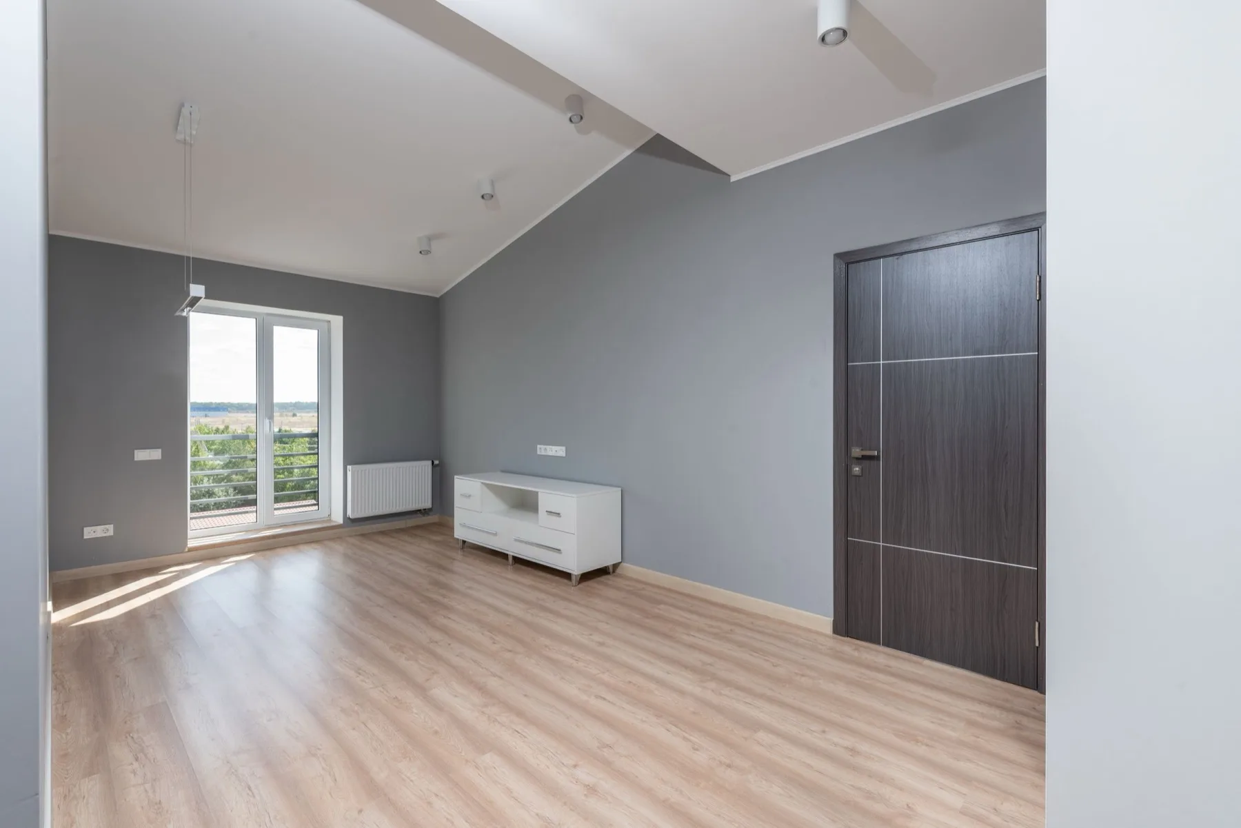 Engineered wood flooring in a modern DC condo bedroom