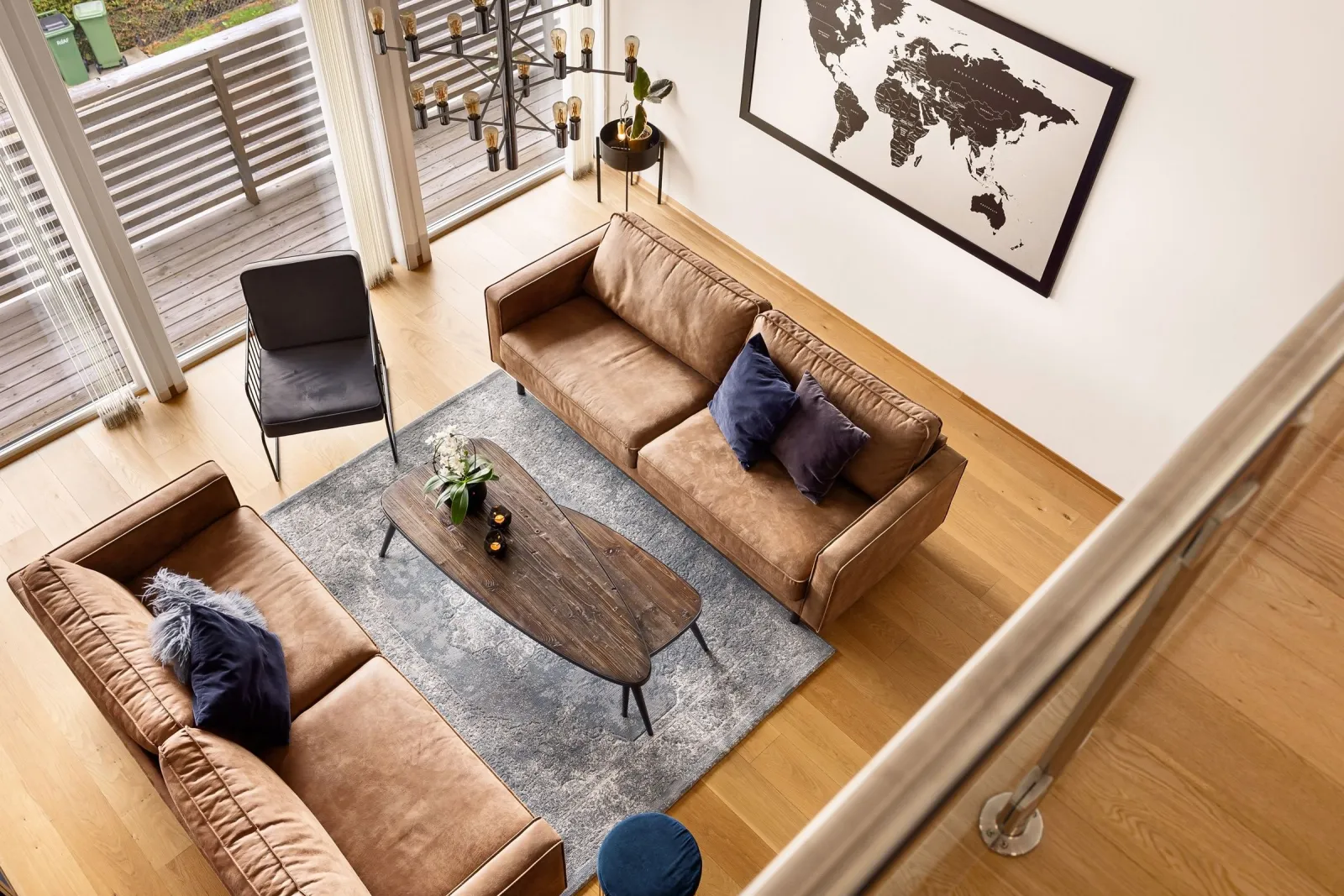 Furnished living room with hardwood flooring — comparing hardwood and LVP