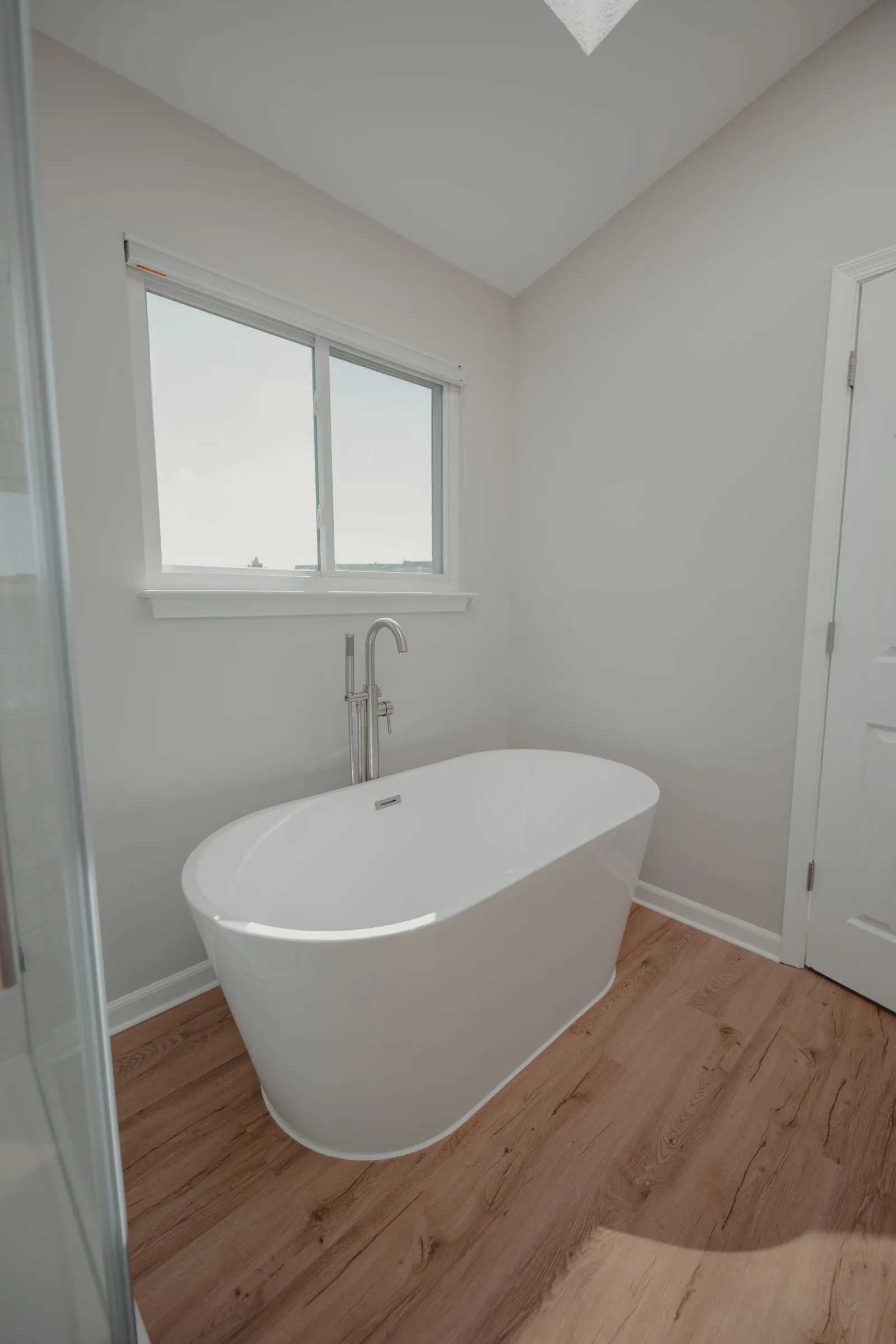 Waterproof LVP flooring in a bright, airy bathroom
