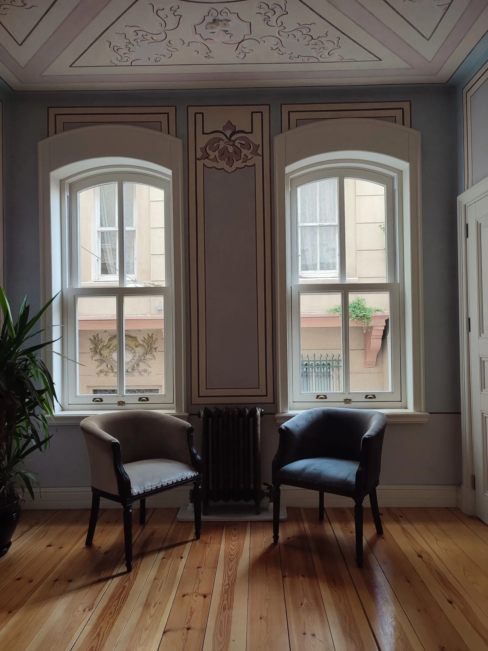 Refinished hardwood floor in a bright sitting room