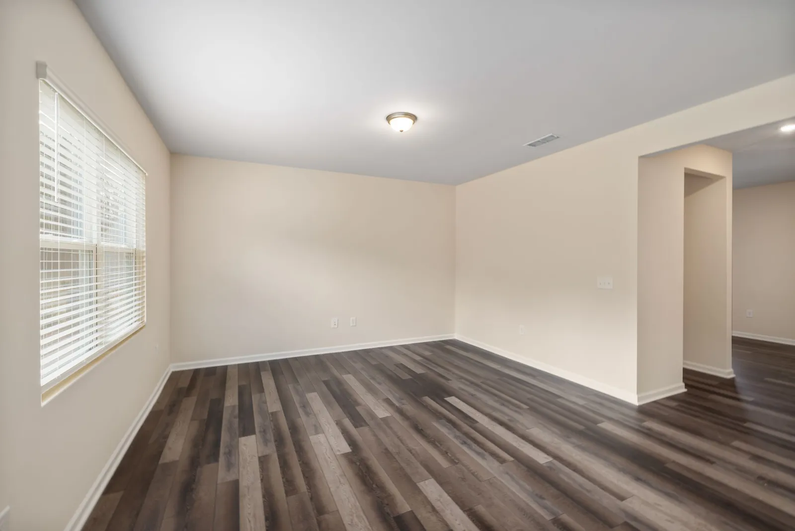 Waterproof dark wood-look vinyl plank flooring in a finished room