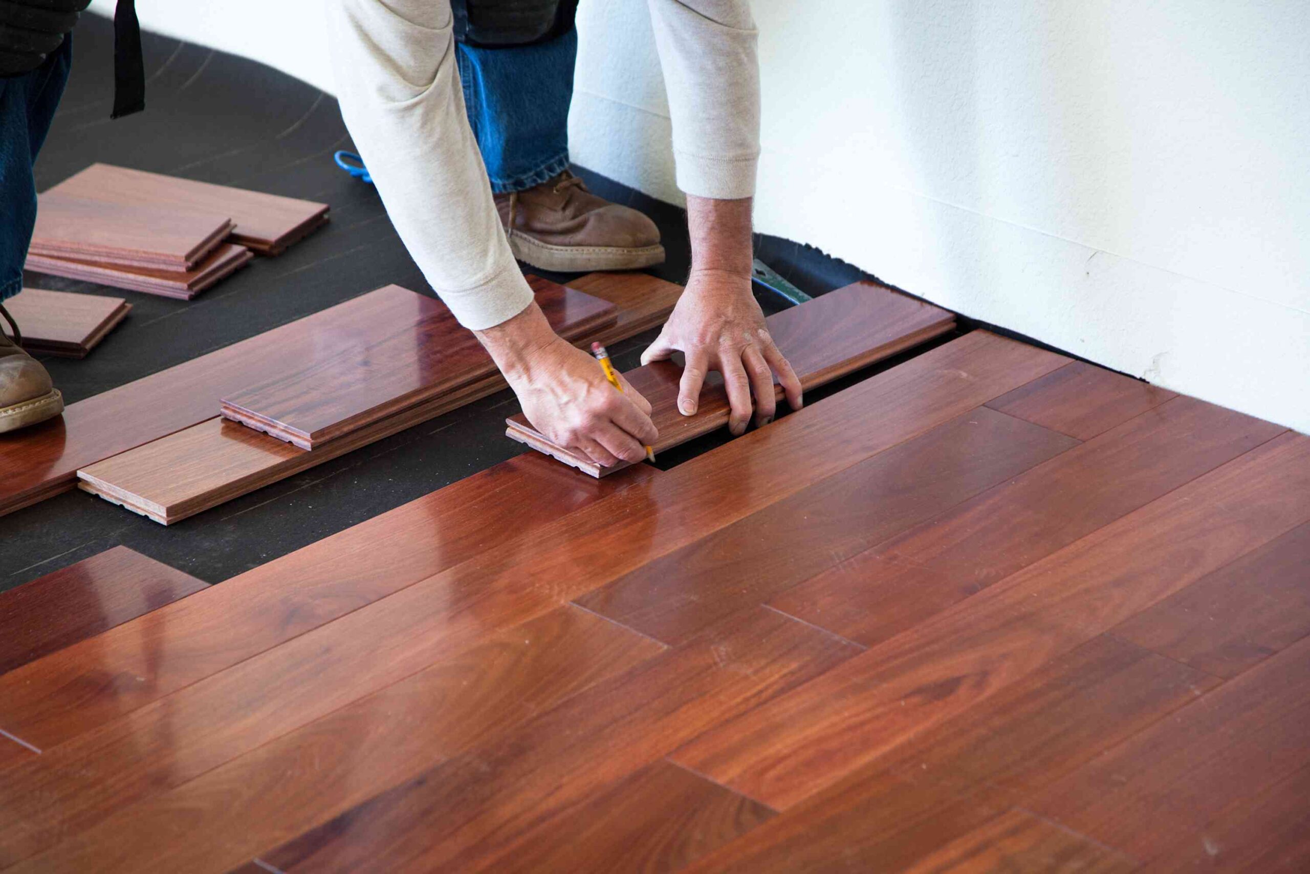Wide-plank hardwood flooring installed in a bright DMV living room by F&F Surface Group